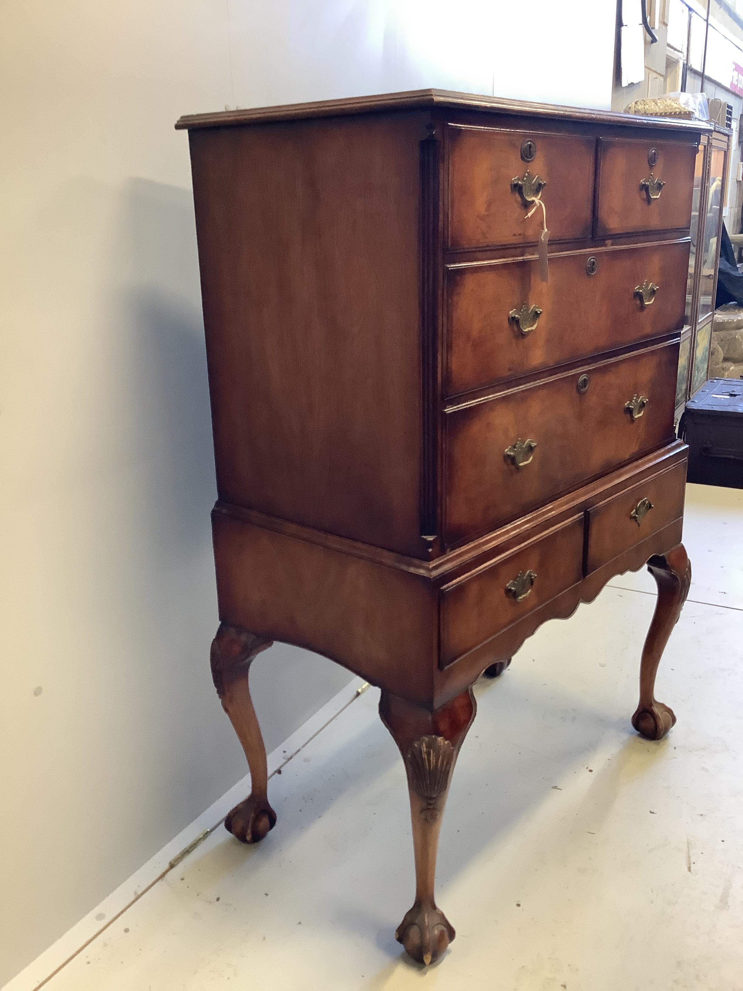 A Queen Anne Revival walnut chest on stand, width 86cm, depth 49cm, height 129cm